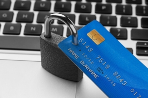 A credit card with a padlock through it.